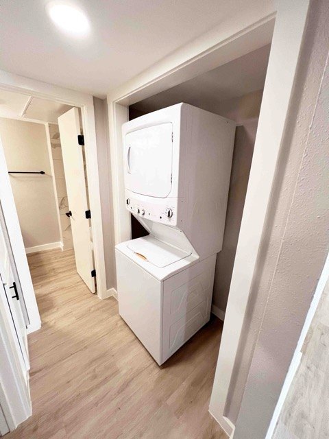Laundry closet with a stacked washer and dryer